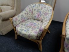 A two seater conservatory settee with armchair