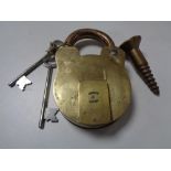 A large 19th century brass padlock with two keys and a screw CONDITION REPORT: This