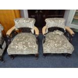 A late Victorian three piece salon suite comprising of pair of tub chairs and chaise longue
