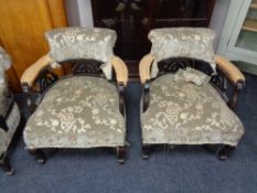 A late Victorian three piece salon suite comprising of pair of tub chairs and chaise longue