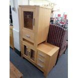 A beech entertainment unit fitted with drawers together with an audio cabinet