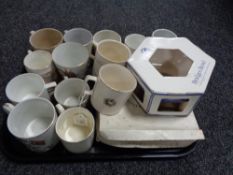 A tray of china, commemorative beakers,