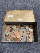 A vintage tin of coins,