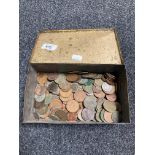 A vintage tin of coins,