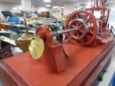 A large model Walking Beam Marine Engine 1904, on plinth under glass cover,