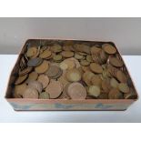 A tin of pre decimal coins, George V pennies,