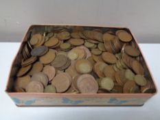 A tin of pre decimal coins, George V pennies,