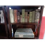 A collection of decorative items, false books, storage box, ceramic horse figures,