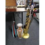 An embossed brass stick pot, ceramic vase, glass art vase,