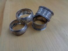 Four silver napkin rings