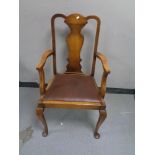 An early twentieth century oak armchair