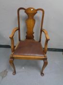 An early twentieth century oak armchair