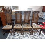 A set of four good quality oak dining chairs with begere backs