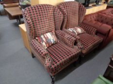 An antique style armchair upholstered in symmetrical fabric