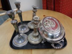 A tray of antique pewter and silver plated candlesticks,