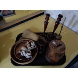 An antique copper pot together with carved wooden figure,