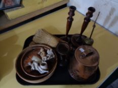 An antique copper pot together with carved wooden figure,