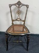 A Victorian mother of pearl inlaid lacquered bedroom chair
