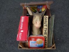 A crate of Donkey head ornament, portable dvd player,