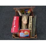 A crate of Donkey head ornament, portable dvd player,