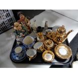 A tray of Continental ornaments, gilded china miniature coffee set,