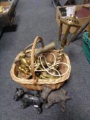 A wicker crate of brass, cast Scotty dog figures,