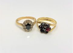 An 18ct gold sapphire and diamond ring and a gold garnet ring (2)