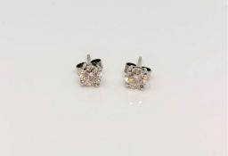 A good pair of 18ct white gold solitaire diamond earrings, approx. 1.