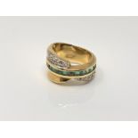 An 18ct gold emerald and diamond ring, size N CONDITION REPORT: 11.