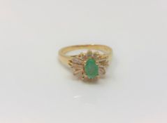 An 18ct gold emerald dress ring, size K CONDITION REPORT: 3.