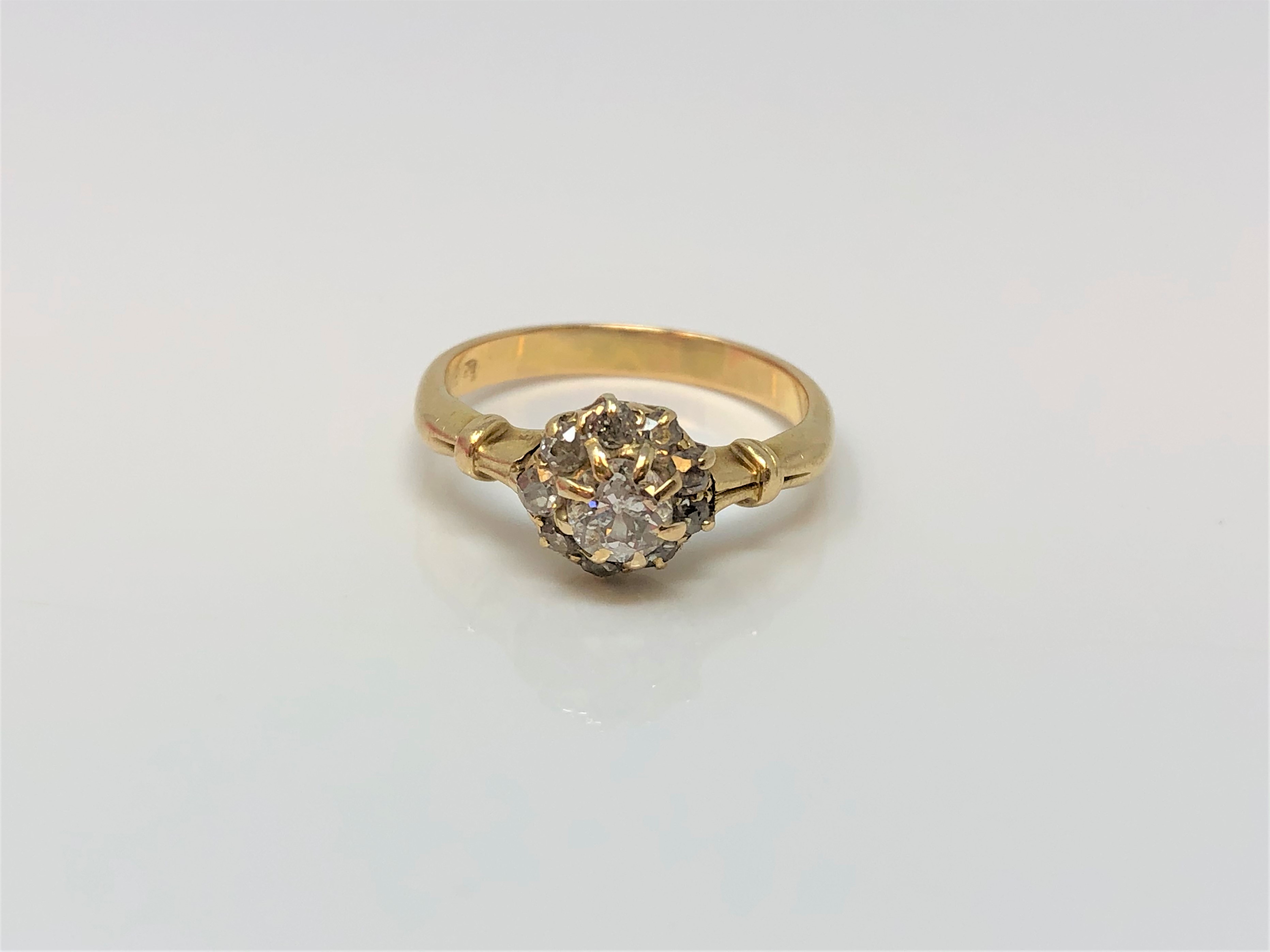 An 18ct gold diamond cluster ring, centre stone approx. 0.