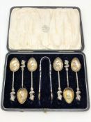 A boxed set of Victorian silver spoons and tongs showing coronation portraits and diamond jubilee