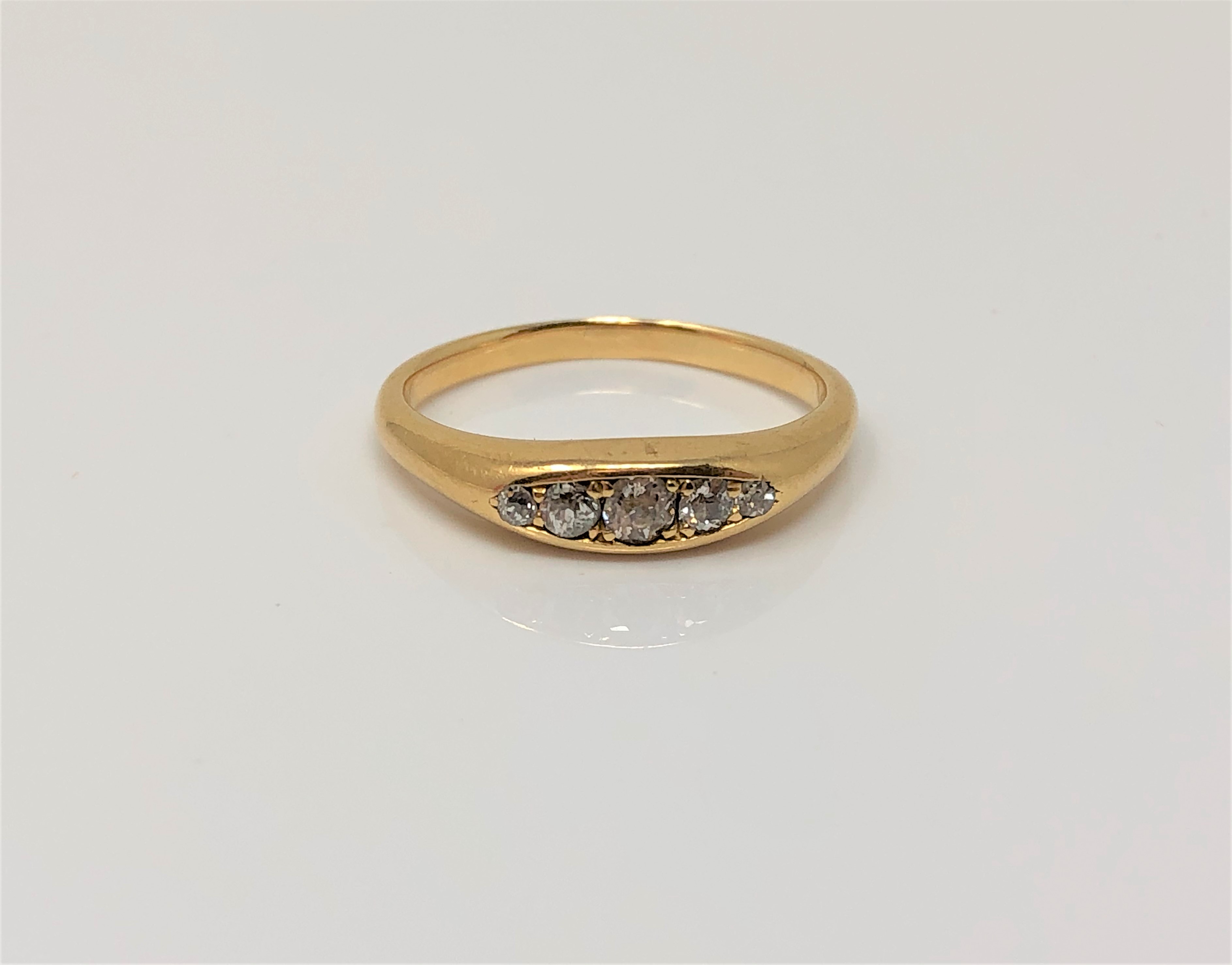 A gold five stone diamond ring, size G CONDITION REPORT: 2.7g. Marked rubbed.