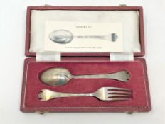 A cased James I style silver fork and spoon