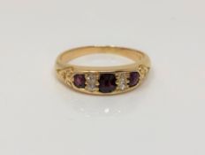 A gold diamond and ruby ring, size N CONDITION REPORT: Marks rubbed. 4g.
