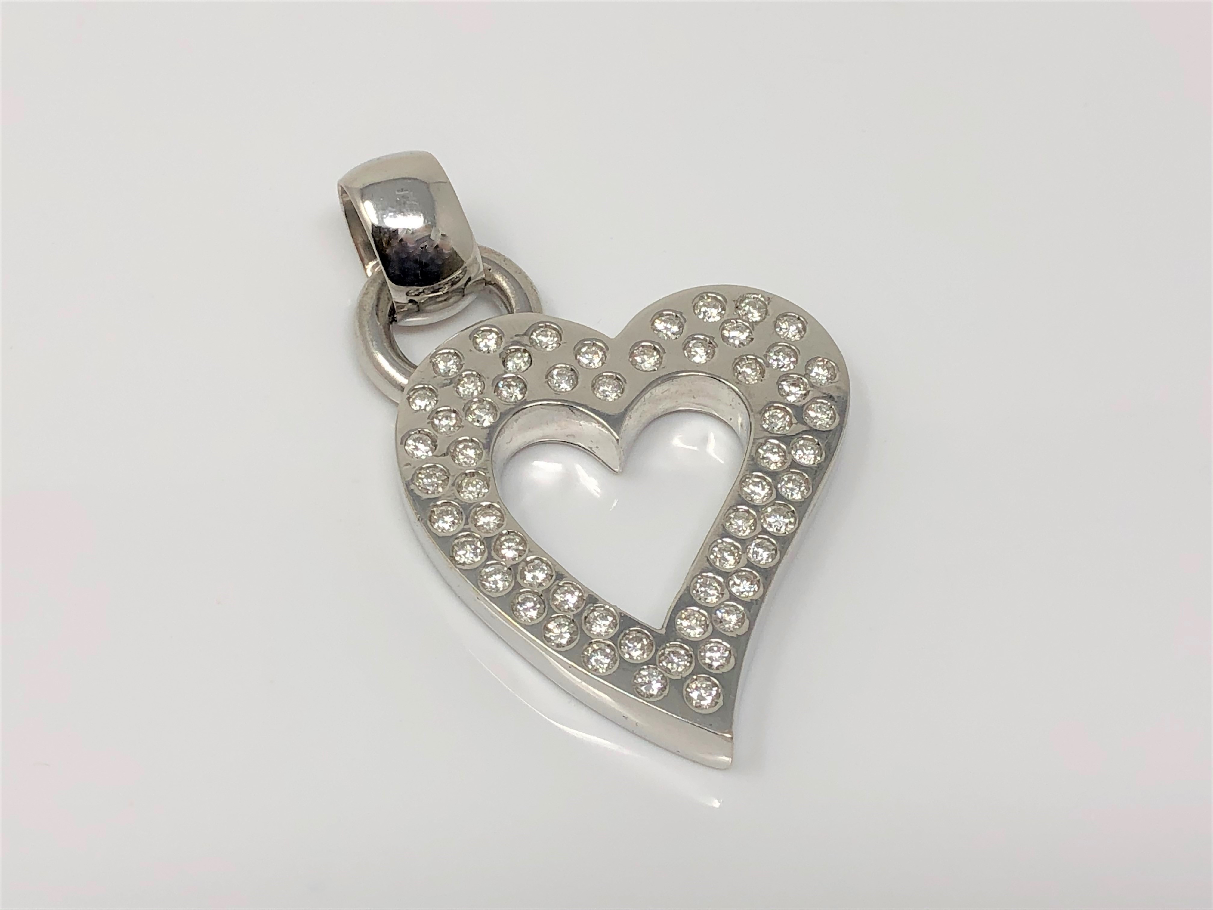 A heavy white gold heart pendant set with 57 diamonds, approx. 2.