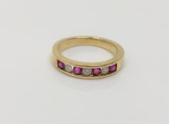 An 18ct gold ruby and diamond ring, size J CONDITION REPORT: 2.
