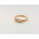 An antique 18ct gold three stone diamond ring, approx. 0.