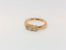 An antique 18ct gold three stone diamond ring, approx. 0.