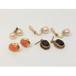 Four pairs of gold earrings set with pearls, coral and garnets.