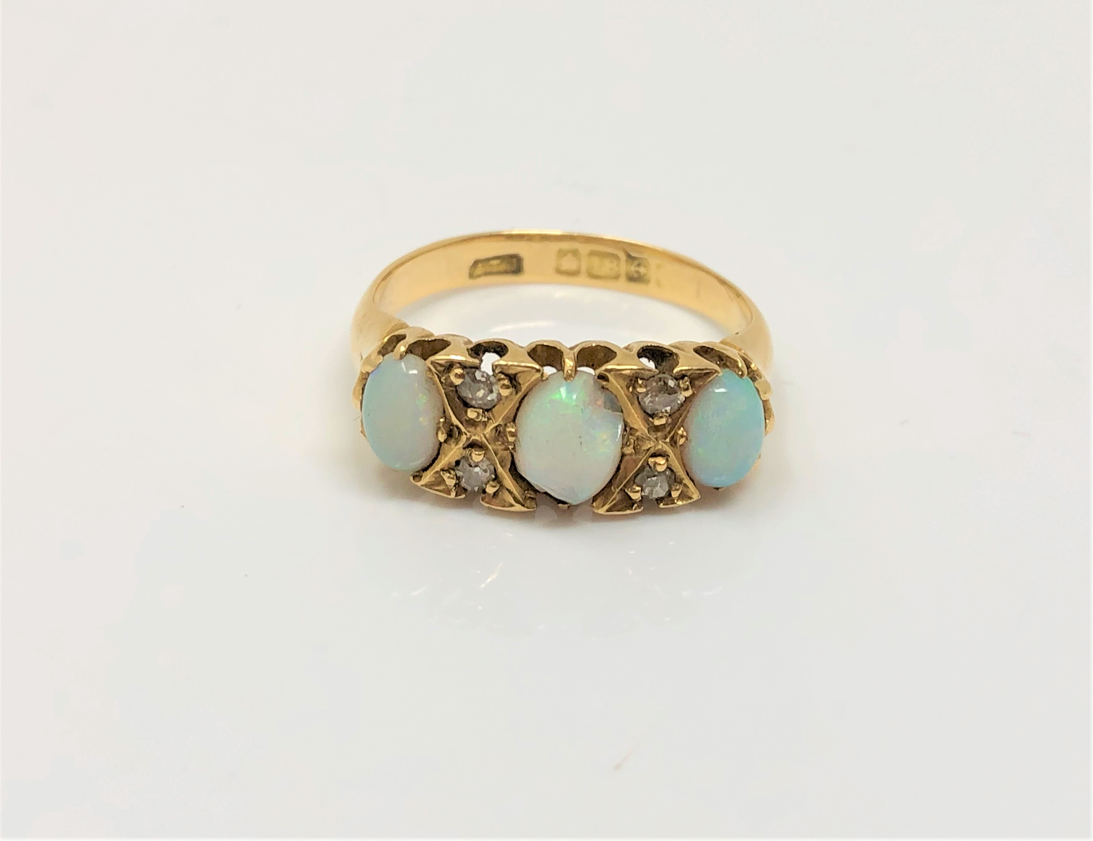 An antique 18ct gold opal and diamond ring,