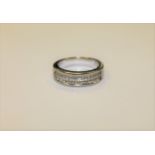 An 18ct white gold ring set with 54 princess cut diamonds CONDITION REPORT: Lot 147