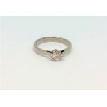 An 18ct gold solitaire diamond ring, approx. 0.