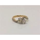An antique 18ct gold old cut two stone diamond ring, approx. 1.