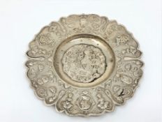 An ornate 19th century foreign silver dish, diameter 11.