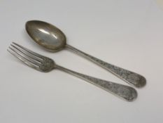 An ornate silver fork and spoon,