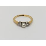 An 18ct gold pearl and diamond ring, size P. CONDITION REPORT: 2.4g.