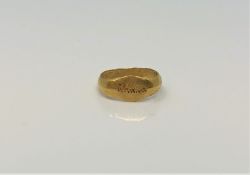 A Roman gold child's ring CONDITION REPORT: The ring lot 245 weighs approximately 1g,