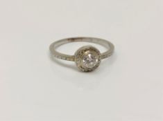 An antique white gold diamond solitaire ring, approximately 0.