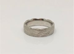 A heavy engraved platinum band ring, size P CONDITION REPORT: 12.